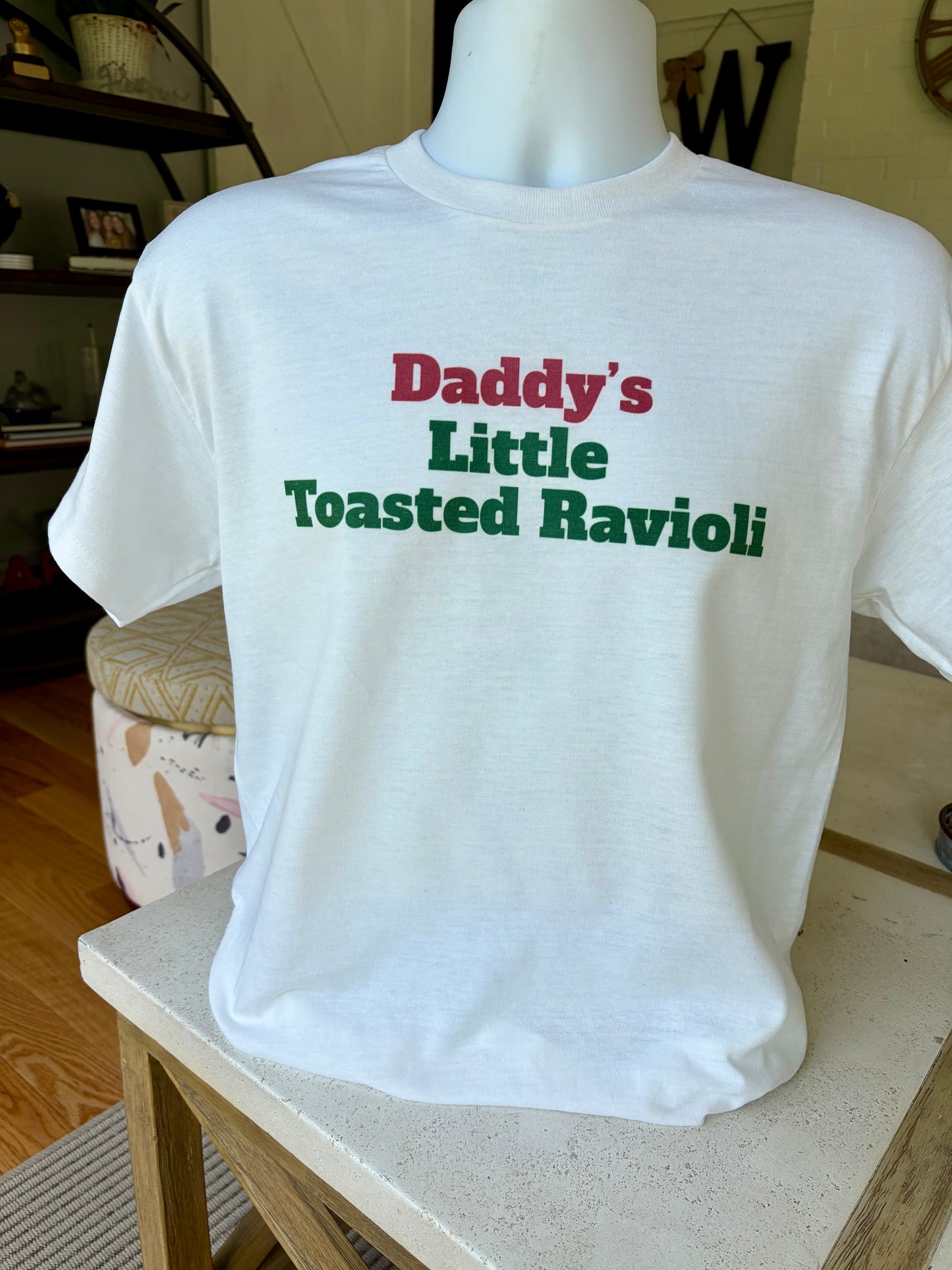 Daddy’s Little Toasted Ravioli T-shirt written in red and green, Italian flag colors.