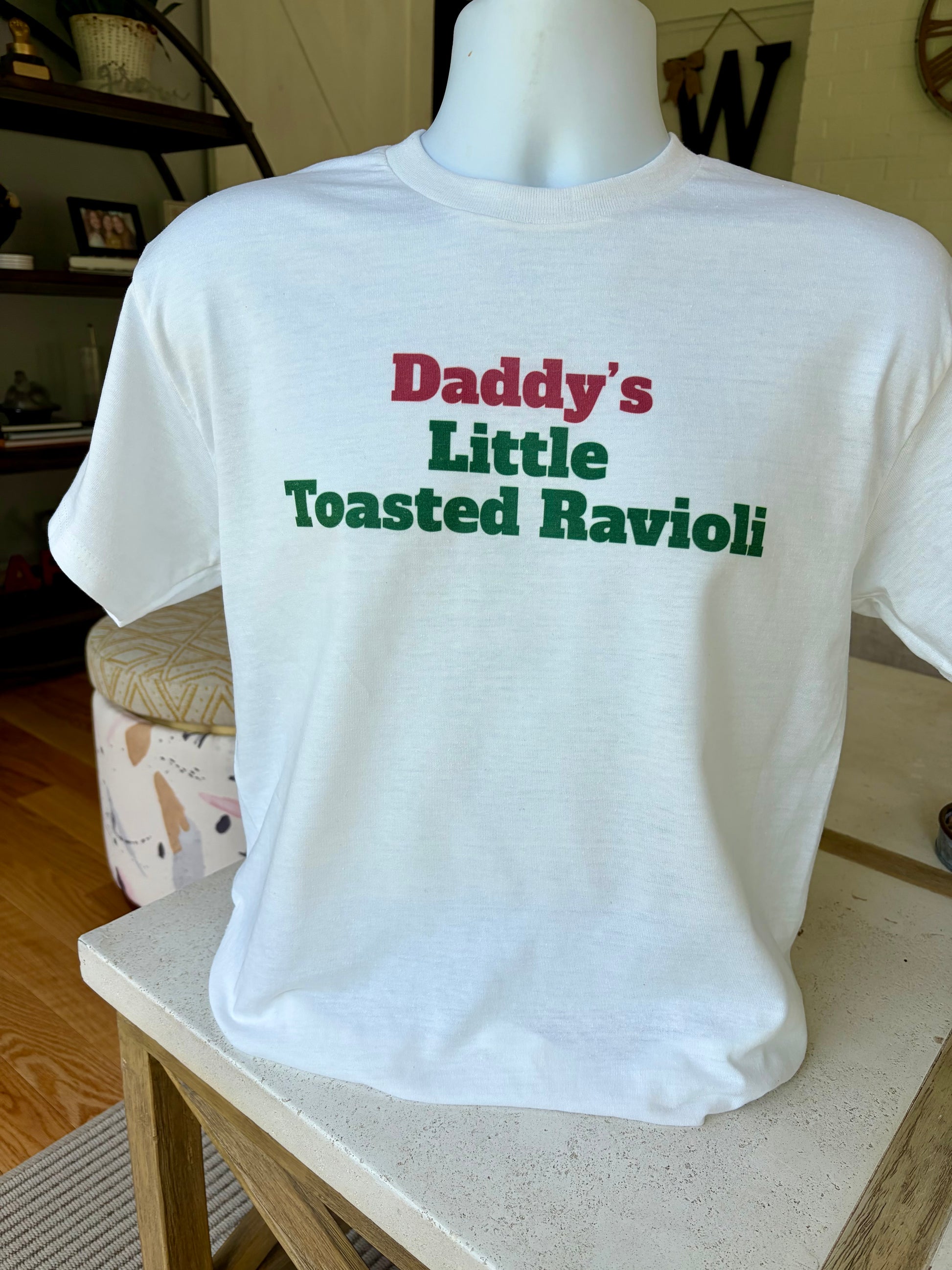 Daddy’s Little Toasted Ravioli T-shirt written in red and green, Italian flag colors.